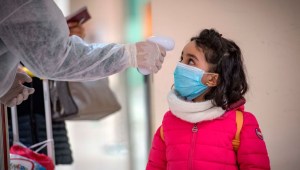 Moroccan health workers scan passengers arriving from Italy for coronavirus COVID-19 at Casablanca Mohammed V International Airport on March 3, 2020. (Photo by FADEL SENNA / AFP) (Photo by FADEL SENNA/AFP via Getty Images)